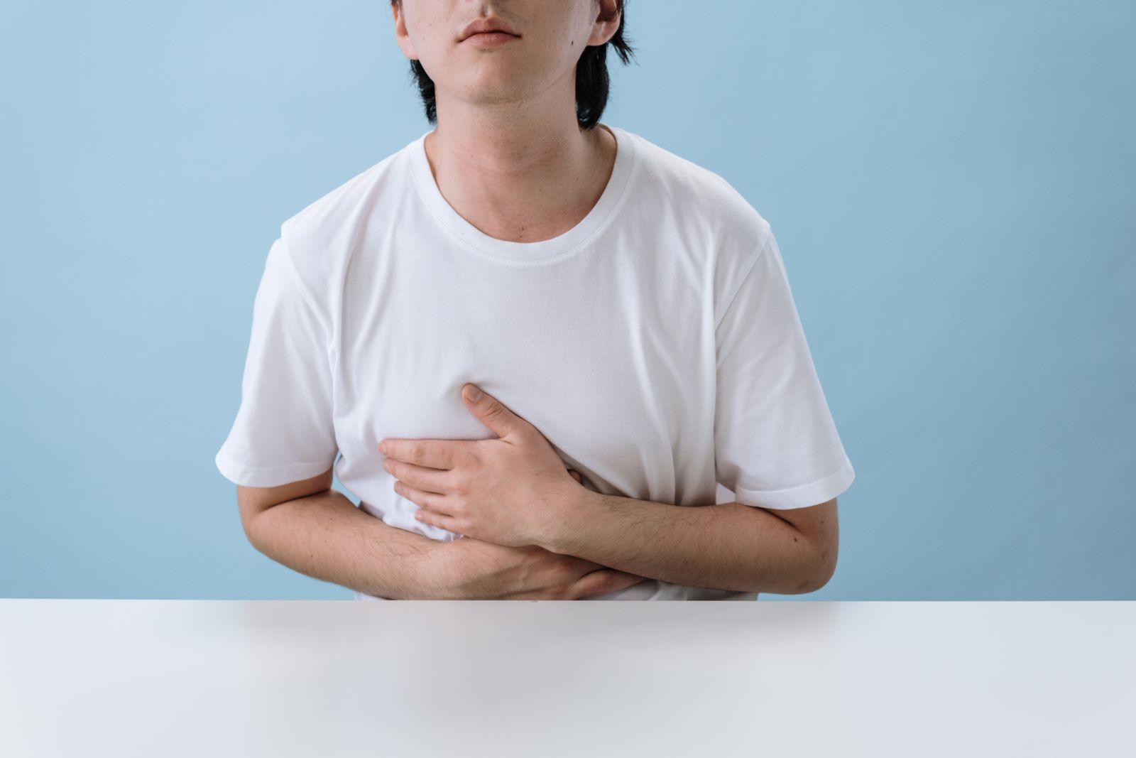 Person holding their stomach