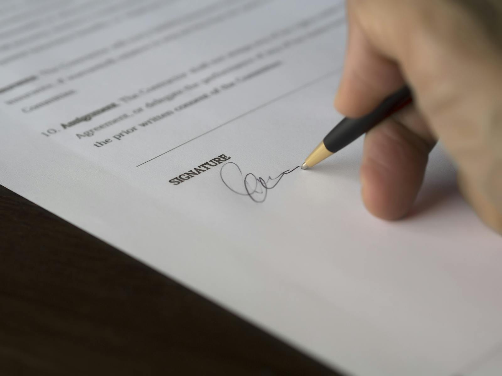 Signing a document with a pen