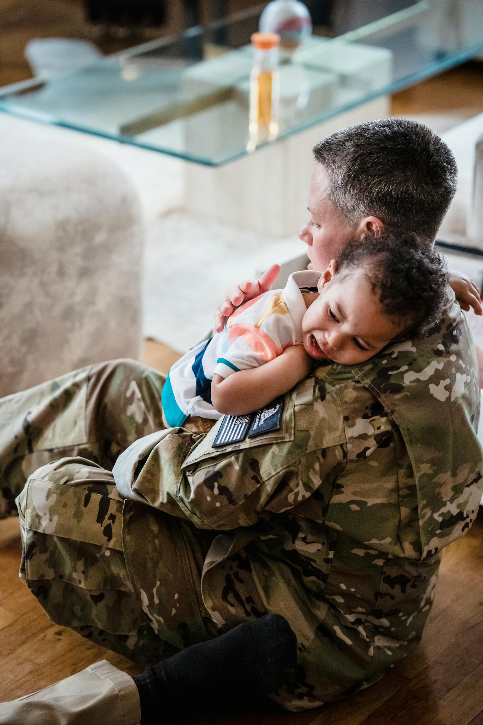 Soldier embracing a child