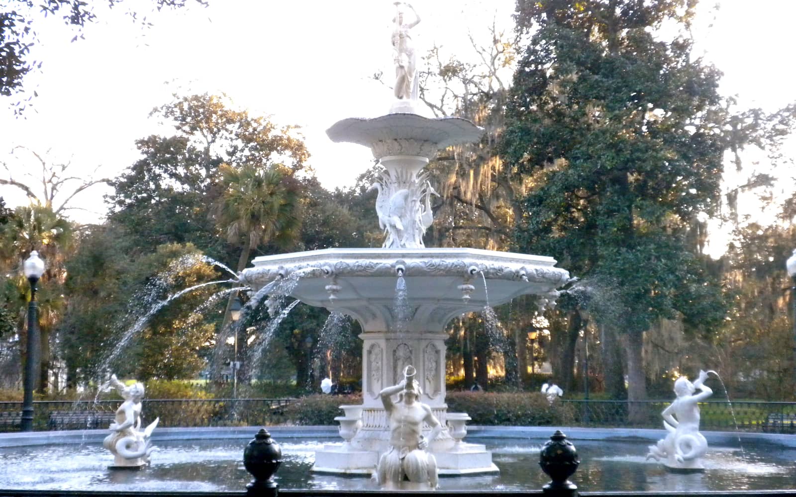 Cast-iron Forsyth Park Fountain surrounded by live oaks in Savannah, Georgia