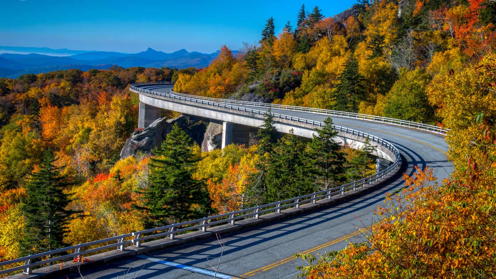 Linn Cove Viaduct curving along Grandfather Mountain amid fall foliage on the Blue Ridge Parkway, North Carolina