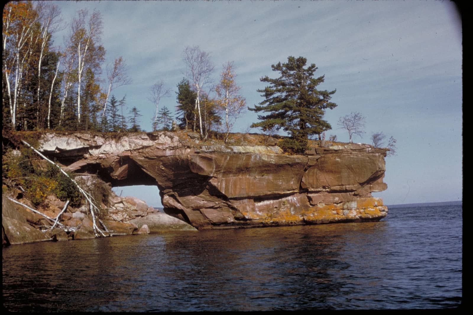 Sandstone sea cave arch rising from Lake Superior at Apostle Islands National Lakeshore, Wisconsin