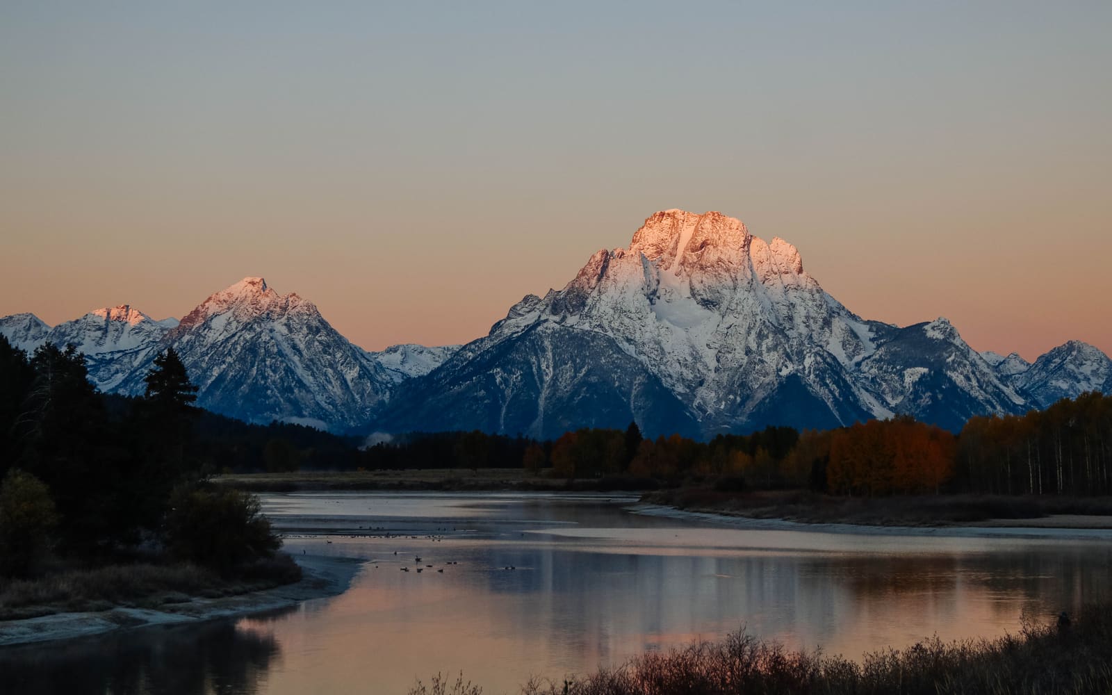 Mount Moran and the Teton Range at sunrise reflected in the Snake River at Oxbow Bend, Grand Teton National Park, Wyoming